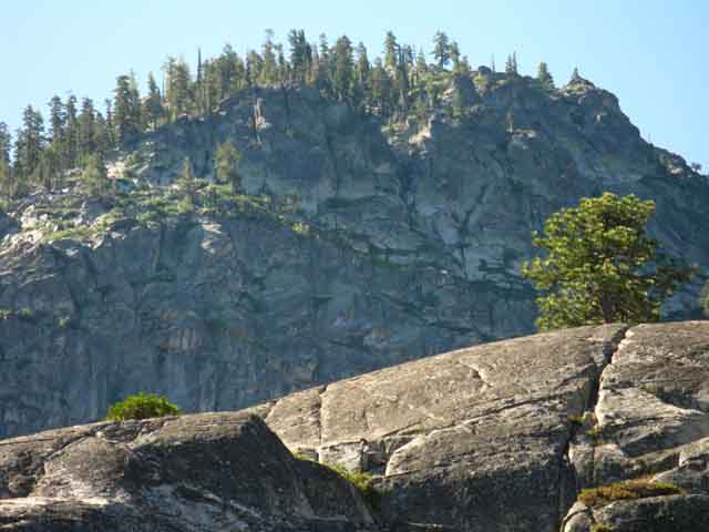 Under a wall at the end of a ridge off the NW flank of Mount Reba